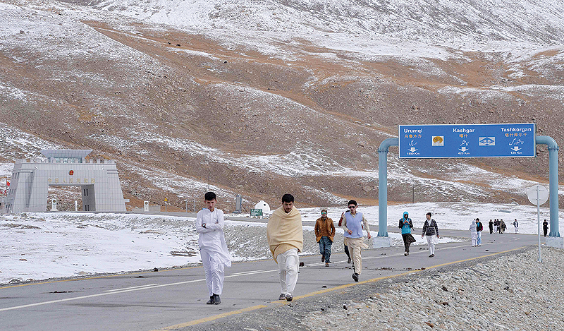 TASHKURGAN, China: Tourists leave the Pakistan-China Khunjerab Pass, the world's highest paved border crossing at 4,600 meters above sea level. China has freed dozens of Uighur women from internment camps on condition they prove their 'adaptability to Chinese society.'- AFP 