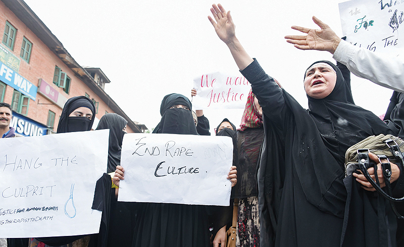 SRINAGAR: Kashmiri protestors shout slogans during a protest yesterday as they call for justice in the case of the alleged rape. — AFP