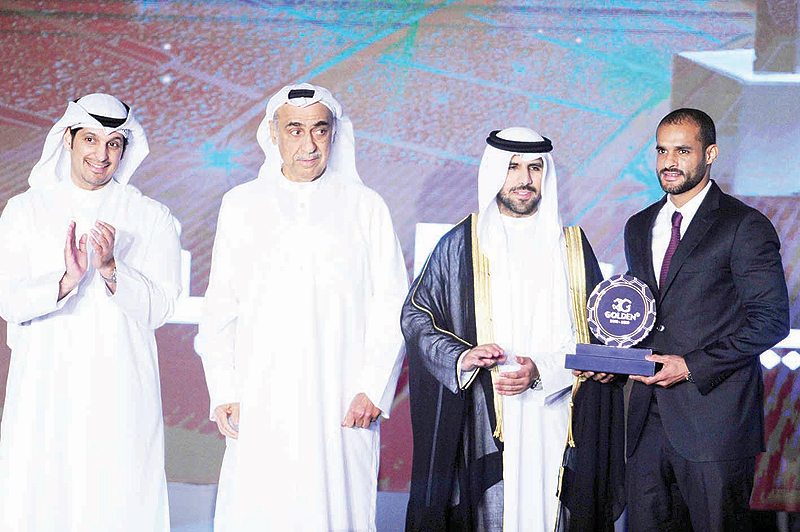 Bader Al-Mutawa (right) receives the Golden One award.