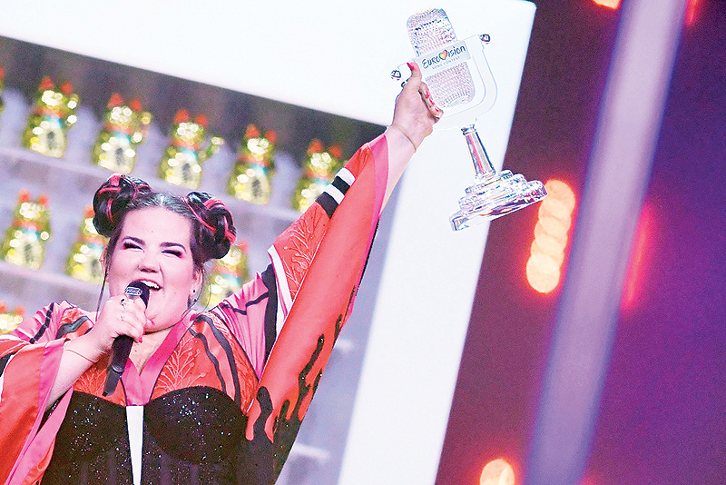 In this file photo Israel's singer Netta Barzilai aka Netta celebrates with the trophy after winning the final of the 63rd edition of the Eurovision Song Contest 2018 at the Altice Arena in Lisbon. -AFP 