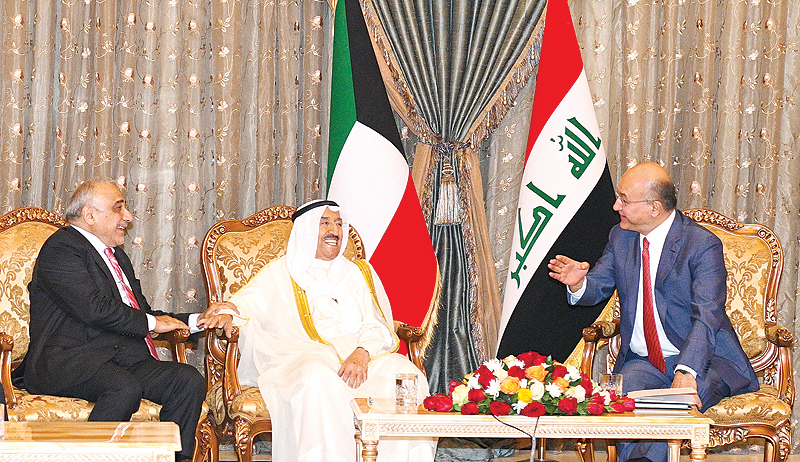 BAGHDAD: HH the Amir of Kuwait Sheikh Sabah Al-Ahmad Al-Jaber Al-Sabah shares a light moment with Iraqi President Barham Salih and Iraqi Prime Minister Adel Abdel Mahdi during his visit to Iraq yesterday. - Amiri Diwan