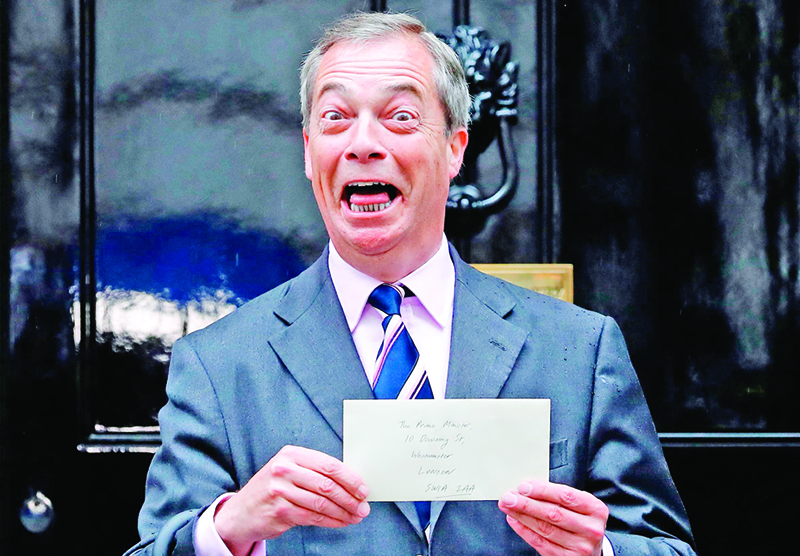 TOPSHOT - Brexit Party leader Nigel Farage reacts as he arrives to deliver a letter addressed to Britain's Prime Minister Theresa May outside 10 Downing Street in central London on June 7, 2019. - Anti-EU populist Nigel Farage's new Brexit Party failed in its bid to win its first seat in Britain's parliament, checking its momentum and raising questions about its ability to compete in Westminster. The by-election in the eastern English city of Peterborough on Thursday was triggered after the sitting MP, Fiona Onasanya, was dumped by voters after being jailed for lying over a speeding offence. (Photo by Tolga AKMEN / AFP)