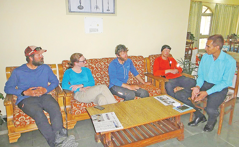 PITHORAGARH, India: In this handout photo released yesterday, rescued mountaineers (from left) Zachary Quai, Ian Wade, Kate Armstrone and Mark Thomas speak with Indo-Tibetan Border Police personnel upon arriving at the ITBP camp after being rescued following an avalanche while climbing Nanda Devi. — AFP