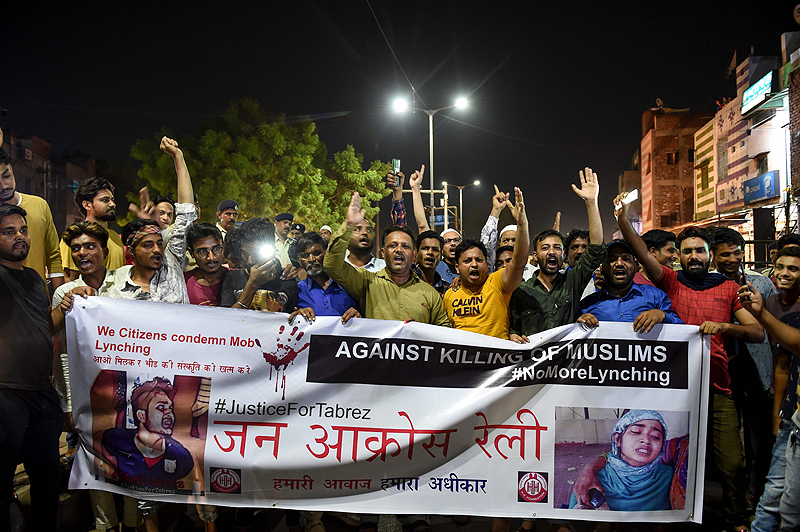 AHMEDABAD, India: Indian Muslims hold a banner yesterday as they protest against the mob lynching of Tabrez Ansari in Jharkhand state. – AFP 