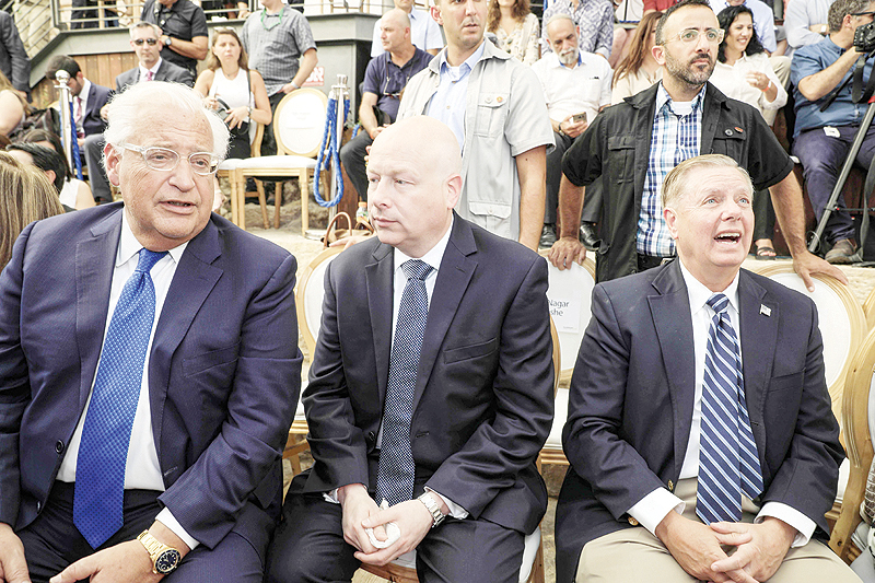 JERUSALEM: (From left) US Ambassador to Israel David Friedman, White House Middle East envoy Jason Greenblatt and US Senator Lindsey Graham attend the opening of an ancient road in the Palestinian neighborhood of Silwan in east Jerusalem yesterday. – AFP  