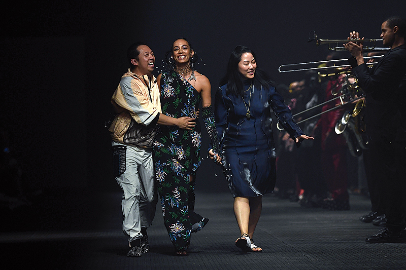 Kenzo’s designers Humberto Leon and Carol Lim, and singer Solange Knowles, acknowledge the audience at the end of presentation of Kenzo’s creations during the men’s spring/summer 2020 fashion collection in Paris. — AFP photos