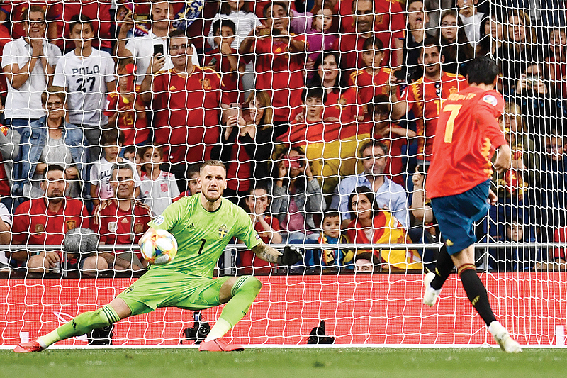 MADRID: Spain's forward Alvaro Morata shoots a penalty kick to score Spain's second goal during the UEFA Euro 2020 group F qualifying football match between Spain and Sweden at the Santiago Bernabeu stadium in Madrid. - AFP