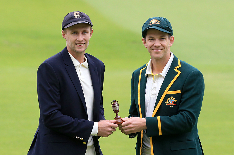 BIRMINGHAM: England’s captain Joe Root (L) and Australia’s captain Tim Paine hold the urn containing the Ashes on the eve of the first Ashes cricket test match between Australia and England at Edgbaston. — AFP