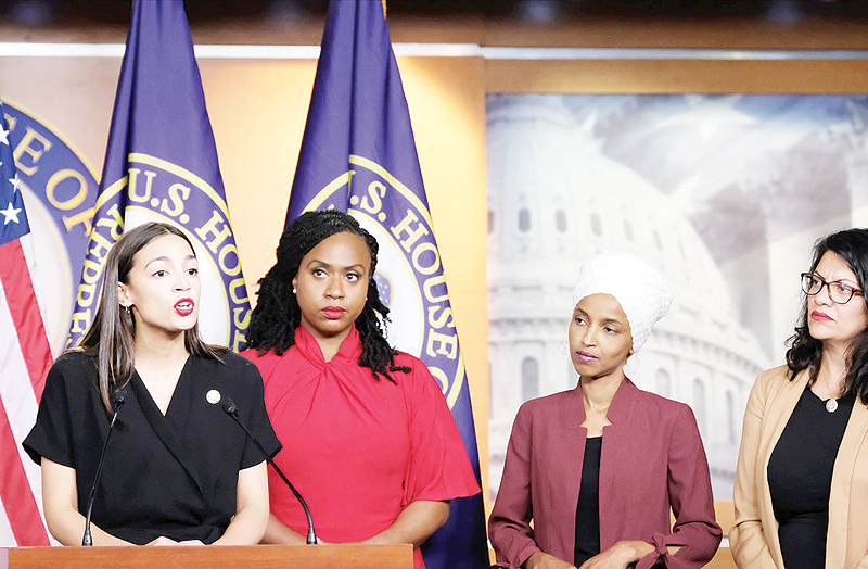 WASHINGTON: (Left to right) US Rep Alexandria Ocasio-Cortez (D-NY) speaks as Reps Ayanna Pressley (D-MA), Ilhan Omar (D-MN) and Rashida Tlaib (D-MI) listen during a news conference at the US Capitol. —AFP