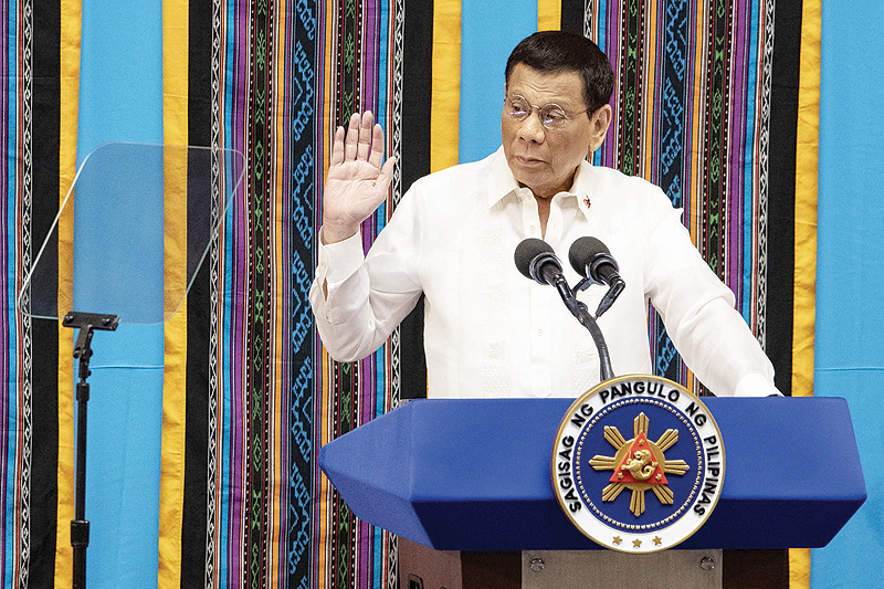 MANILA: Philippine President Rodrigo Duterte gestures as he delivers his state of the nation address at Congress in Manila. — AFP