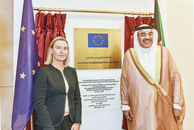 KUWAIT: Kuwaiti Foreign Minister Sheikh Sabah Al-Khaled Al-Hamad Al-Sabah and European Union Foreign Policy Chief Federica Mogherini pose for a picture in front of a plaque during the opening ceremony of the European representative office yesterday. - Photo by Yasser Al-Zayyat 