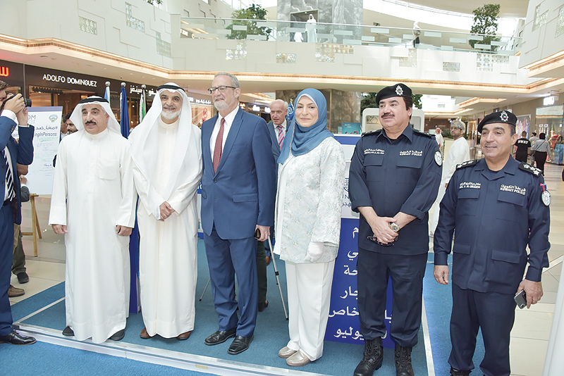 KUWAIT: Senior officials from the interior ministry, IOM and the US ambassador to Kuwait are seen during an anti-human trafficking event at The Avenues mall yesterday. - KUNA 