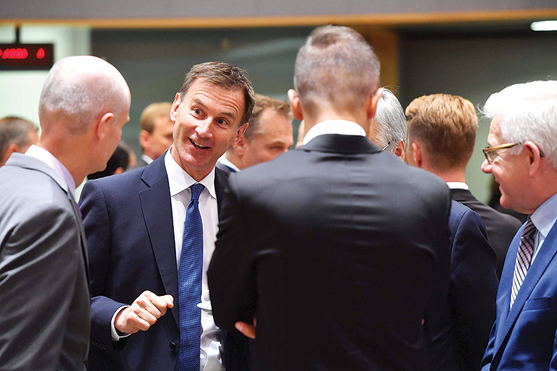 BRUSSELS: Britain’s Foreign Secretary Jeremy Hunt (2nd left) talks with Dutch Foreign Minister Stef Blok (left) and Polish Foreign MinisterJacek Czaputowicz (right) during a Foreign Affairs meeting at the EU headquarters in Brussels yesterday. — AFP