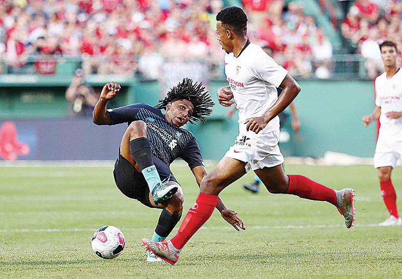 BOSTON: Yasser Larouci #65 of Liverpool is fouled by Joris Gnagnon #24 during the second half of a pre-season friendly at Fenway Park in Boston, Massachusetts. - AFP 