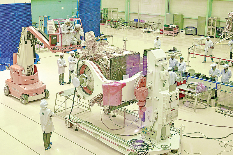 BANGALORE: In this file photo, Indian Space Research Organization (ISRO) scientists work on the orbiter vehicle of ‘Chandrayaan-2’, India’s first moon lander and rover mission planned and developed by the ISRO, in Bangalore. India will make a second attempt today to send a landmark spacecraft to the Moon after an apparent fuel leak forced last week’s launch to be aborted. — AFP