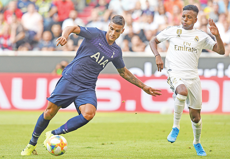 MUNICH: Real Madrid’s Brazil midfielder Rodrygo (R) and Tottenham’s Argentinian midfielder Erik Lamela vie for the ball during the Audi Cup football match between Real Madrid and Tottenham Hotspur. — AFP