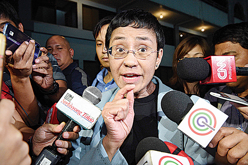 MANILA: This file photo shows Philippine journalist Maria Ressa speaking to the media as she arrives at the National Bureau of Investigation (NBI) headquarters after her arrest in Manila. —AFP