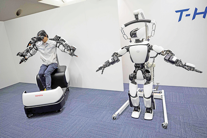 TOKYO: Toyota Motor Corp demonstrates the T-HR3 humanoid robot which will be used during the Tokyo 2020 Olympic and Paralympic Games, in Tokyo. - AFP 