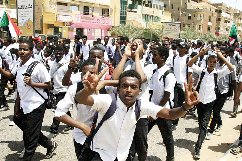 KHARTOUM: Sudanese students protest in the capital yesterday, a day after teenagers were shot at a rally. – AFP n