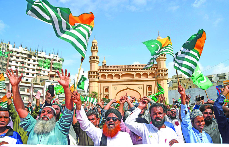 Supporters of the Tehreek-Labaik Pakistan (TLP) party shout slogans during an anti-Indian protest rally in Karachi on August 20, 2019, as they condemn India stripping the disputed Kashmir region of its special autonomy and imposing a lockdown two weeks ago. - US President Donald Trump on Monday spoke with India's Prime Minister Narendra Modi, urging a reduction of tension between India and Pakistan over the disputed Kashmir region. (Photo by ASIF HASSAN / AFP)