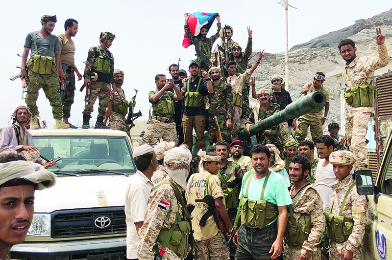 Yemeni supporters of the southern separatist movement pose for a picture in Khor Maksar, in the Yemeni southern port city of Aden on August 10, 2019. (Photo by Nabil HASAN / AFP)