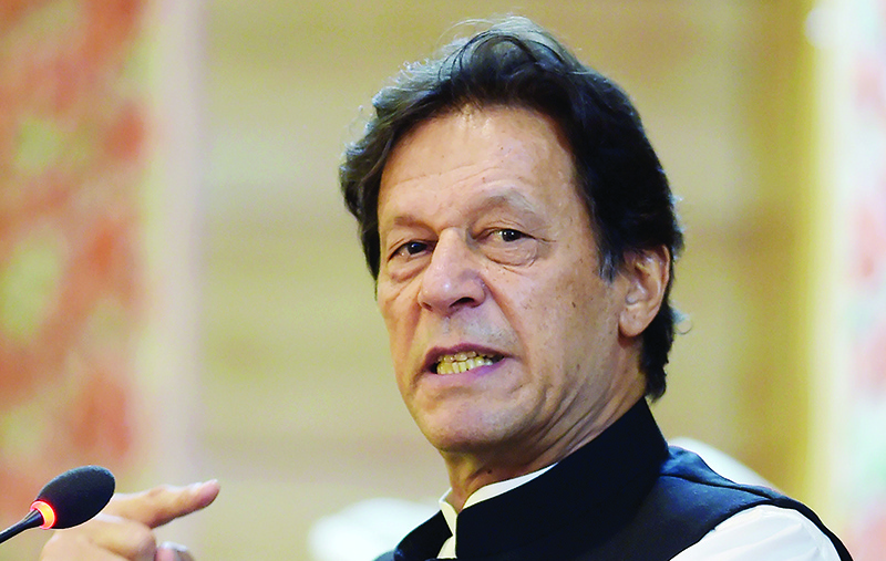 Pakistan's Prime Minister Imran Khan addresses the legislative assembly in Muzaffarabad, the capital of Pakistan-controlled Kashmir on August 14, 2019, to mark the country's Independence Day. - His visit to mark the country's Independence Day comes more than a week after Indian Prime Minister Narendra Modi delivered a surprise executive decree to strip its portion of the Muslim-majority Himalayan region of its special status. (Photo by AAMIR QURESHI / AFP)