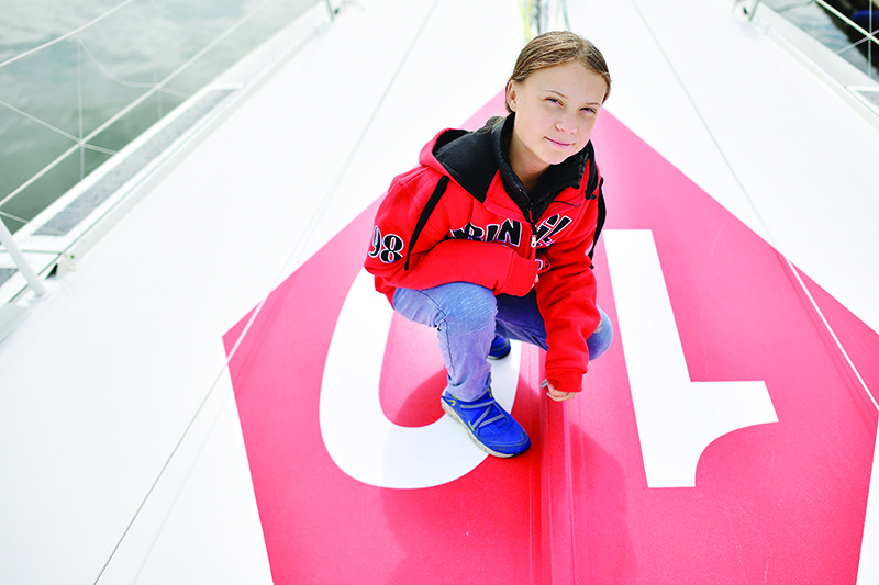 Swedish climate activist Greta Thunberg poses for a photograph during an inteview with AFP onboard the Malizia II sailing yacht at the Mayflower Marina in Plymouth, southwest England, on August 13, 2019 ahead of her journey across the Atlantic to New York where she will attend the UN Climate Action Summit next month. - A year after her school strike made her a figurehead for climate activists, Greta Thunberg believes her uncompromising message about global warming is getting through -- even if action remains thin on the ground. The 16-year-old Swede, who sets sail for New York this week to take her message to the United States, has been a target for abuse but sees that as proof she is having an effect. (Photo by Ben STANSALL / AFP)