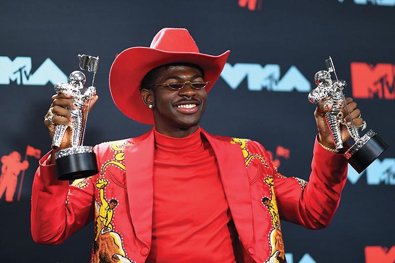 TOPSHOT - US rapper Lil Nas X poses with the Song of the Year Award in the press room during the 2019 MTV Video Music Awards at the Prudential Center in Newark, New Jersey on August 26, 2019. (Photo by Johannes EISELE / AFP)