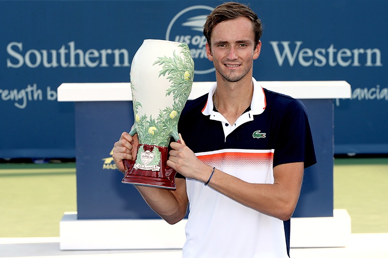 MASON, OHIO - AUGUST 18: Daniil Medvedev of Russia poses for photographers after defeating David Goffin of Belgium during the men's final of the Western &amp; Southern Open at Lindner Family Tennis Center on August 18, 2019 in Mason, Ohio.   Matthew Stockman/Getty Images/AFP