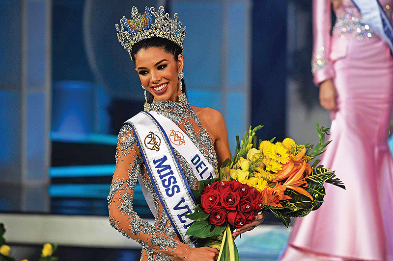 Thalia Olvino representative of the Delta Amacuro reacts during the Miss Venezuela beauty pageant in Caracas, Venezuela.-AFP photos