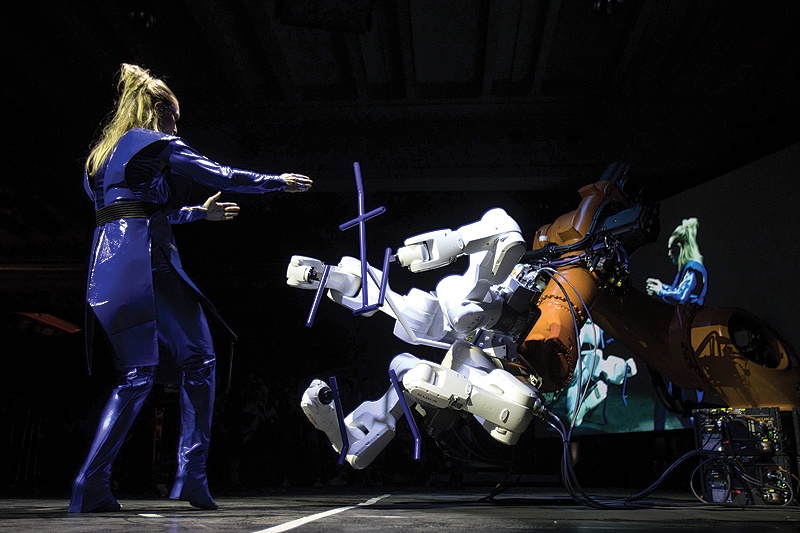 Dancer and choreographer Silke Grabinger performs with a robot during her performance at the Ars Electronica in Linz, Upper Austria.