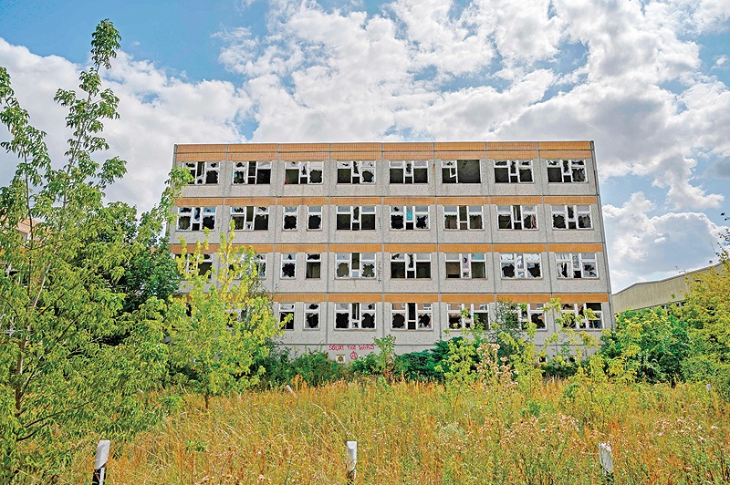 MAGDEBURG: A disused east German ‘Plattenbau’ concrete panel building with broken windows is seen in Magdeburg. — AFP