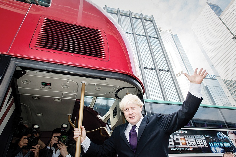 In this file photo taken on October 18, 2013 London Mayor Boris Johnson gestures after getting out of a doube-decker bus during his visit in Hong Kong on October 18, 2013. Wrightbus, the manufacturers of London’s iconic red “double decker” buses, entered administration yesterday, a spokesman for the company confirmed. —AFP