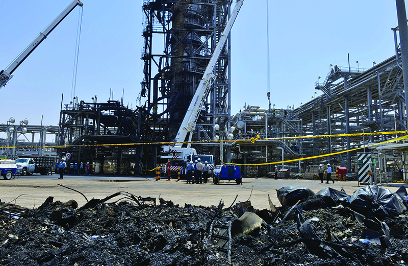 TOPSHOT - A destroyed installation in Saudi Arabia's Khurais oil processing plant is pictured on September 20, 2019. - Saudi Arabia said on September 17 its oil output will return to normal by the end of September, seeking to soothe rattled energy markets after attacks on two instillations that slashed its production by half. The strikes on Abqaiq ñ- the world's largest oil processing facility ñ- and the Khurais oil field in eastern Saudi Arabia roiled energy markets and revived fears of a conflict in the tinderbox Gulf region. (Photo by Fayez Nureldine / AFP)