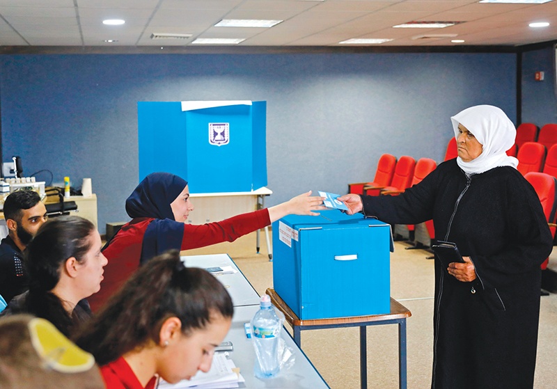 Arab Israelis votes during Israel's parliamentary election at a polling station in Kafr Manda near Haifa on September 17, 2019. (Photo by Ahmad GHARABLI / AFP)