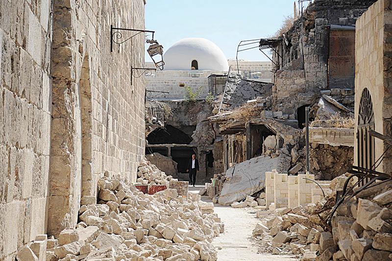 A picture taken during a guided tour with the Russian army shows a damaged street in the old Aleppo market on September 27, 2019. (Photo by Maxime POPOV / AFP)