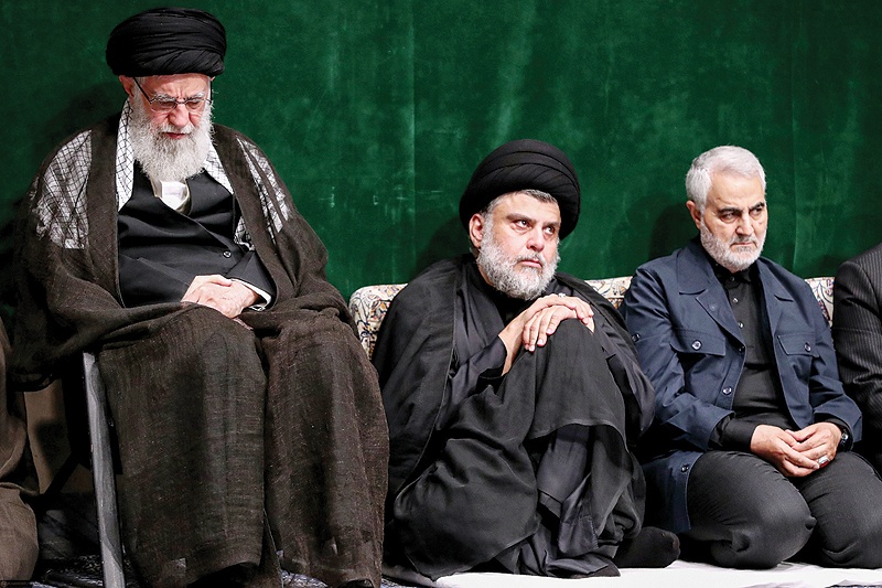 TEHRAN: (From left) Iran's Supreme Leader Ayatollah Ali Khamenei, Iraqi Shiite cleric, politician and militia leader Muqtada Al-Sadr and Qasem Soleimani, Iranian Revolutionary Guards Corps lieutenant general and commander of the Quds Force sit during a ceremony commemorating Ashoura on Tuesday. - AFP 