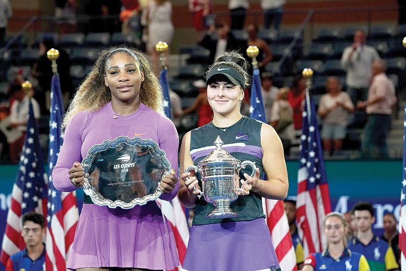 NEW YORK: Bianca Andreescu of Canada (R) poses with the trophy after she won against Serena Williams of the US after the Women’s Singles Finals match at the 2019 US Open at the USTA Billie Jean King National Tennis Center in New York. — AFP