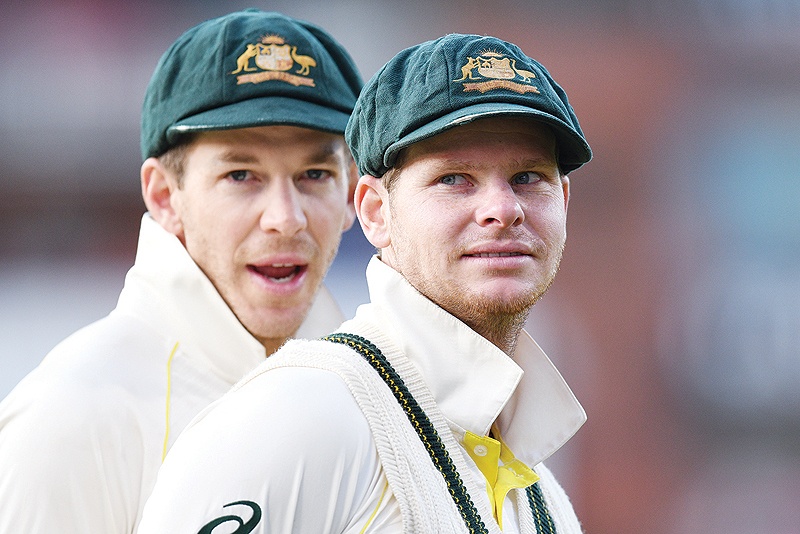 MANCHESTER: Australia’s captain Tim Paine (L) and Australia’s Steve Smith (R) celebrate their victory on the field after the fourth Ashes cricket Test match between England and Australia at Old Trafford in Manchester. — AFP