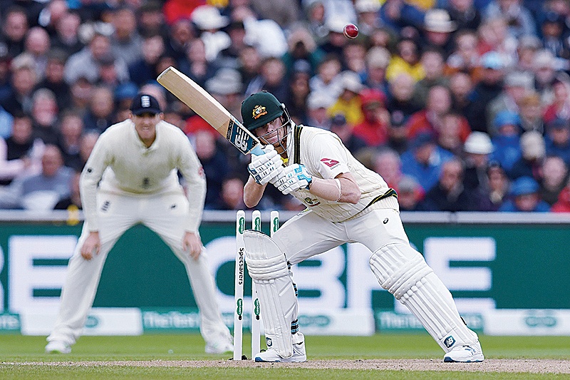 MANCHESTER: Australia’s Steve Smith ducks a bouncer on the first day of the fourth Ashes cricket Test match between England and Australia at Old Trafford in Manchester, north-west England yesterday. —AFP