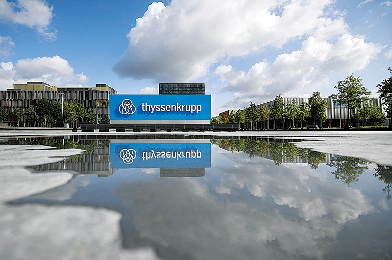 ESSEN: This file photo, shows a board bearing the logo of German industrial conglomerate ThyssenKrupp outside its headquarters in Essen, western Germany. —AFP
