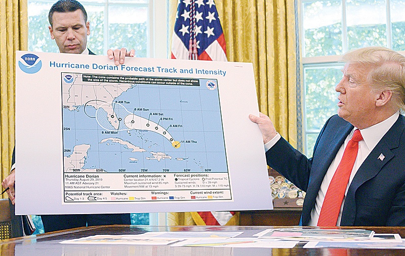 WASHINGTON DC: In this file photo taken on September 4, 2019, US President Donald Trump and Acting US Secretary of Homeland Security Kevin McAleenan update the media on Hurricane Dorian preparedness from the Oval Office at the White House. - AFP n