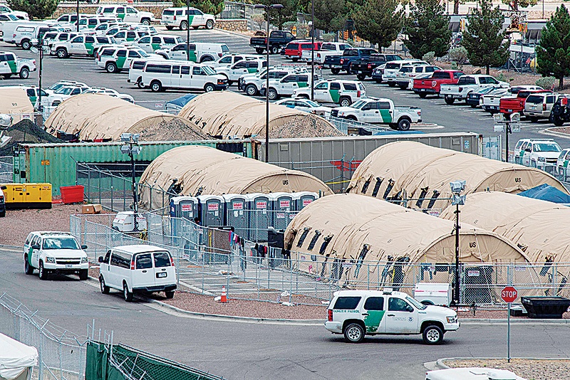TEXAS: In this file photo tents are seen at a temporary holding facility for migrants that has been in use since early May, to hold the record numbers of migrants entering the El Paso border sector, in El Paso, Texas. —AFP