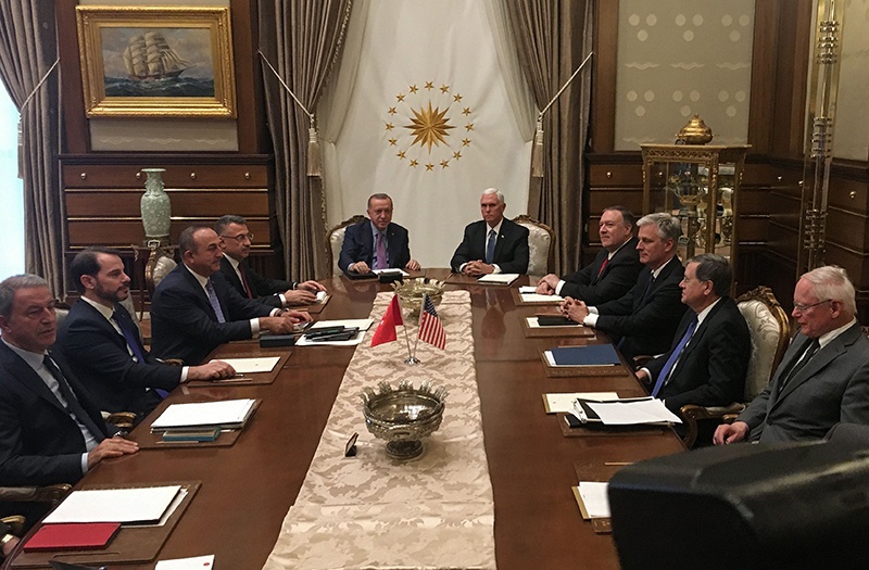 Turkish President Recep Tayyip Erdogan (C-L) and US Vice President Mike Pence (C-R), joined by Secretary of State Mike Pompeo (4R) and Turkish Foreign Minister Mevlut Cavusoglu (3L) and senior aides, meet at the presidential complex in Ankara, Turkey, on October 17, 2019. - Pence is seeking a ceasefire in Turkeyís offensive against Syrian Kurdish fighters. -AFP