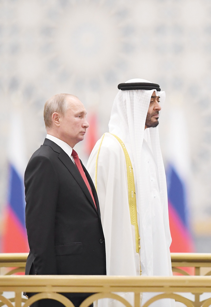 Russian President Vladimir Putin (L) is received by Sheikh Mohamed bin Zayed al-Nahyan, Crown Prince of Abu Dhabi, during a welcome ceremony in the UAE capital's Al-Watan presidential palace on October 15, 2019. (Photo by KARIM SAHIB / AFP)