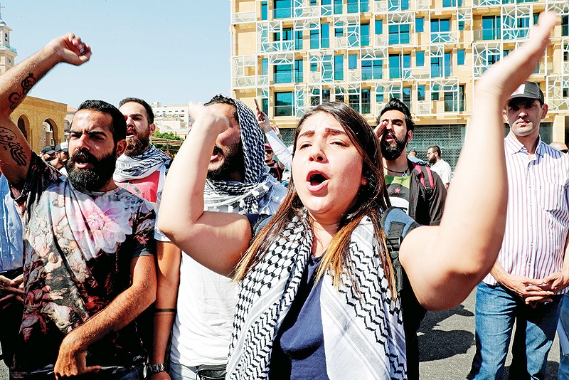 BEIRUT: Lebanese protesters chant slogans during a demonstration in central Beirut’s Martyr Square. Lebanese protested in the capital over increasingly difficult living conditions, amid fears of a dollar shortage and possible price hikes. — AFP