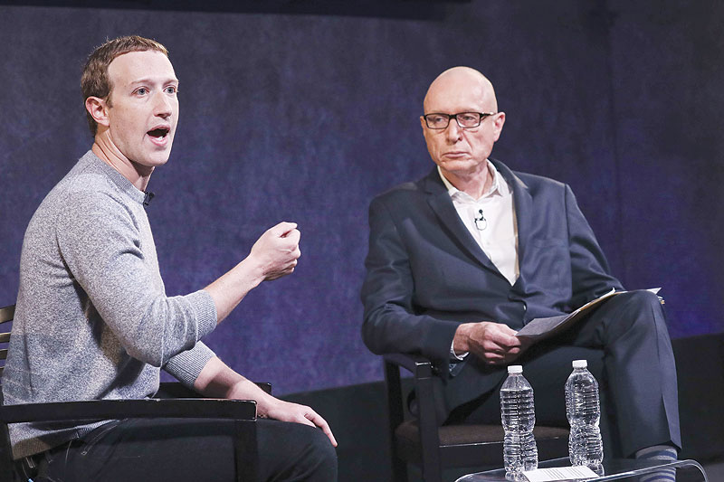 NEW YORK: Facebook CEO Mark Zuckerberg and News Corp CEO Robert Thompson speak about the new Facebook News feature at the Paley Center for Media on Friday. - AFP 