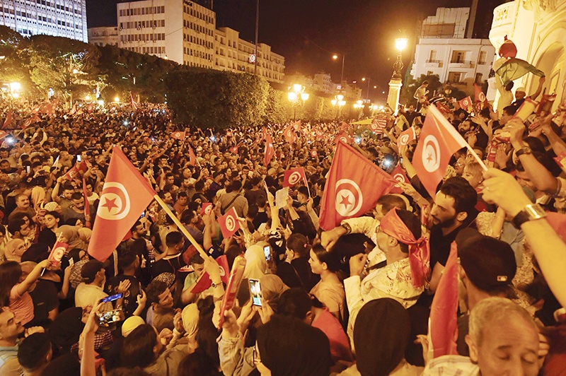 Tunisians gather to celebrate the victory of Kais Saied in the Tunisia's presidential runoff on October 13, 2019, in the capital Tunis. - Conservative academic Kais Saied, a political outsider, won a landslide victory Sunday in Tunisia's presidential runoff, sweeping aside his rival, media magnate Nabil Karoui, state television said. - AFP