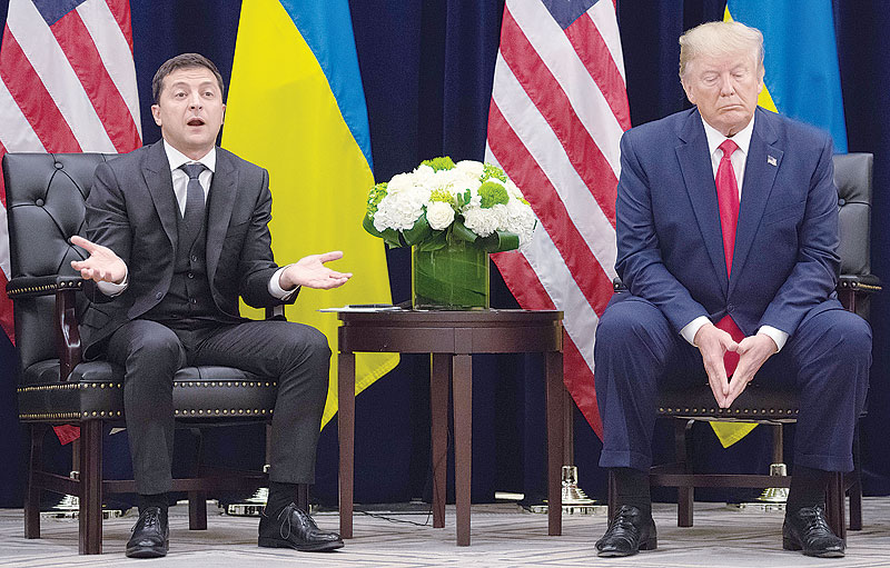 WASHINGTON: In this file photo taken on September 25, 2019 US President Donald Trump listens as Ukrainian President Volodymyr Zelensky speaks to the press during a meeting in New York on the sidelines of the United Nations General Assembly. - AFP 