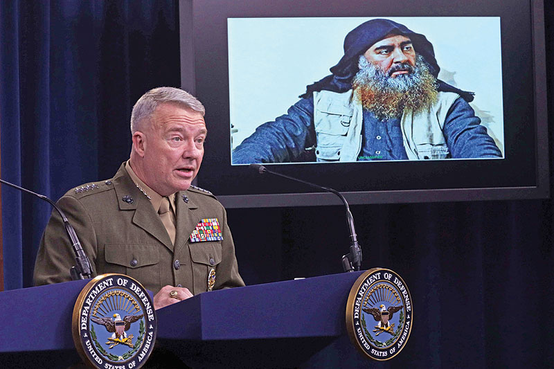 ARLINGTON: US Marine Corps Gen Kenneth McKenzie, commander of US Central Command, speaks as a picture of Abu Bakr Al-Baghdadi is seen during a press briefing at the Pentagon in Arlington, Virginia. — AFP
